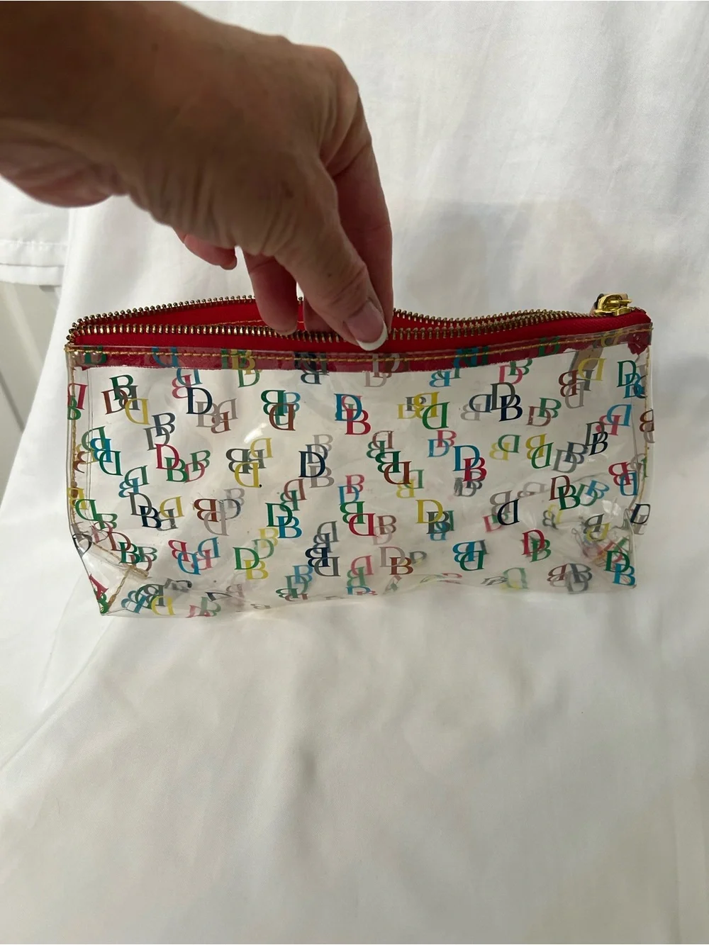 Dooney & Bourke Clear Cosmetic Pouch with Multicolor DB Print and Red Trim